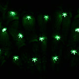 Pulsar Mini High Lights with glowing green hemp leaf LED bulbs against a dark background, 16 feet long