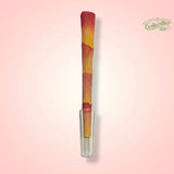 CaliGreenGold Reusable Glass Tip Mouthpiece for rolling papers, front view on pink background