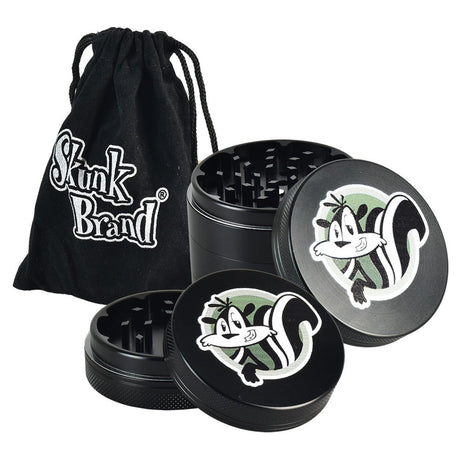 Skunk Brand Shredder Grinder in black with fun skunk design, portable 4-part aluminum build, and carry pouch