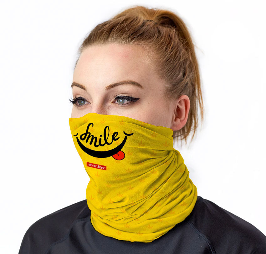StonerDays Smile Neck Gaiter in yellow with smile design, front view on model