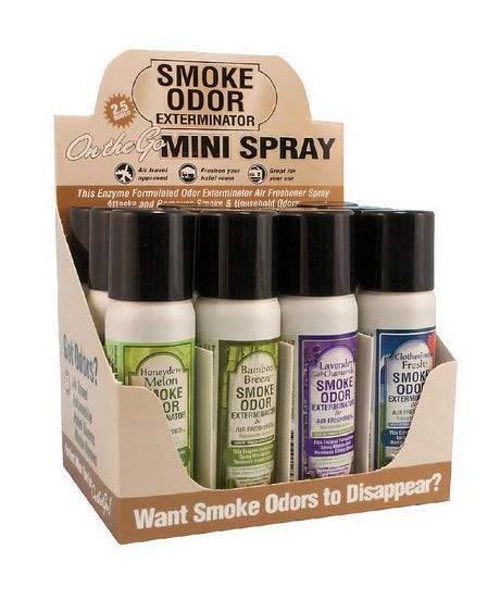 12-pack Smoke Odor Exterminator Spray in various scents displayed in a cardboard stand