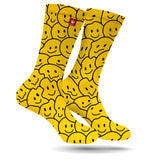 StonerDays Happy Face Melt Weed Socks in yellow with smiley face pattern, front view on white background
