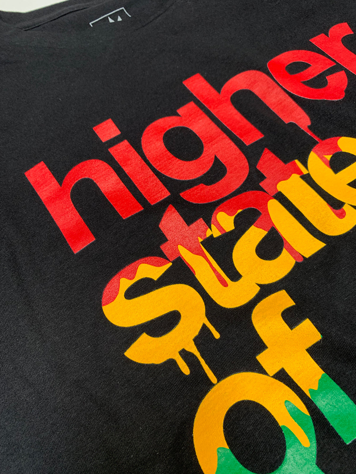 StonerDays Hsom Rasta T-shirt close-up with vibrant 4-color screenprint on black cotton