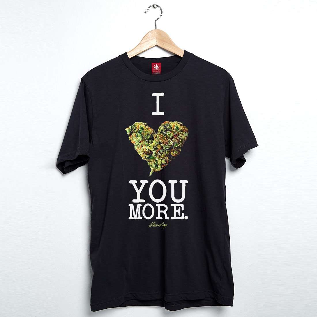 StonerDays black men's tee with 'I Bud You More' print, cannabis heart design, front view on hanger
