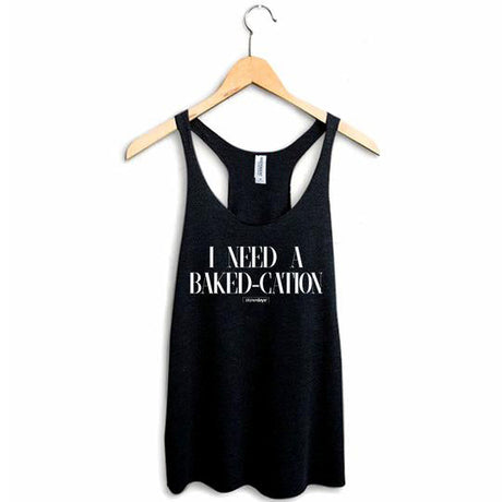 StonerDays black racerback tank with "I Need A Bakedcation" print, hanging on wooden hanger, sizes S-XXL