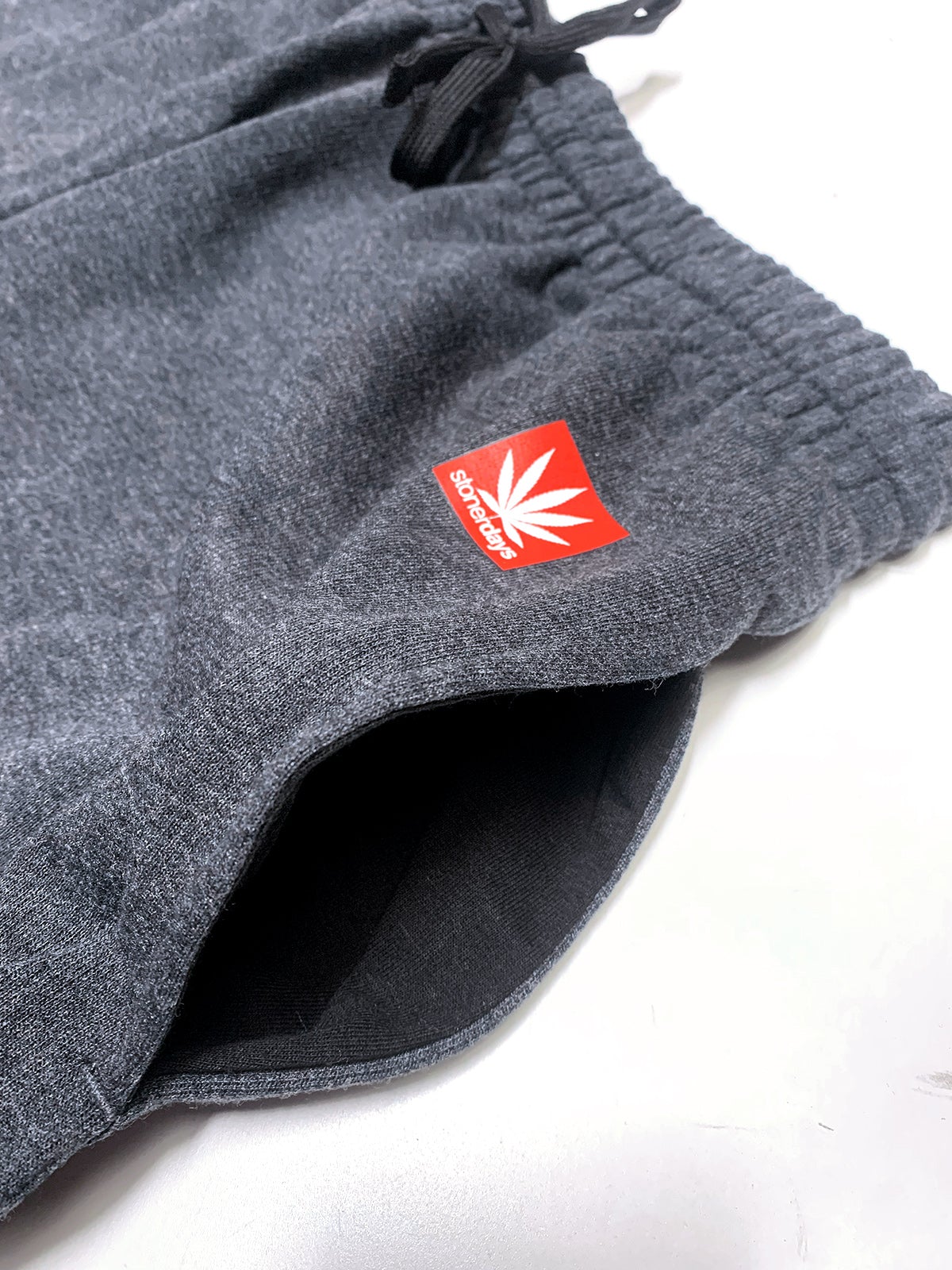 Close-up of StonerDays Mls All-stars Smoke Heather Grey Jogger with Cannabis Leaf Logo