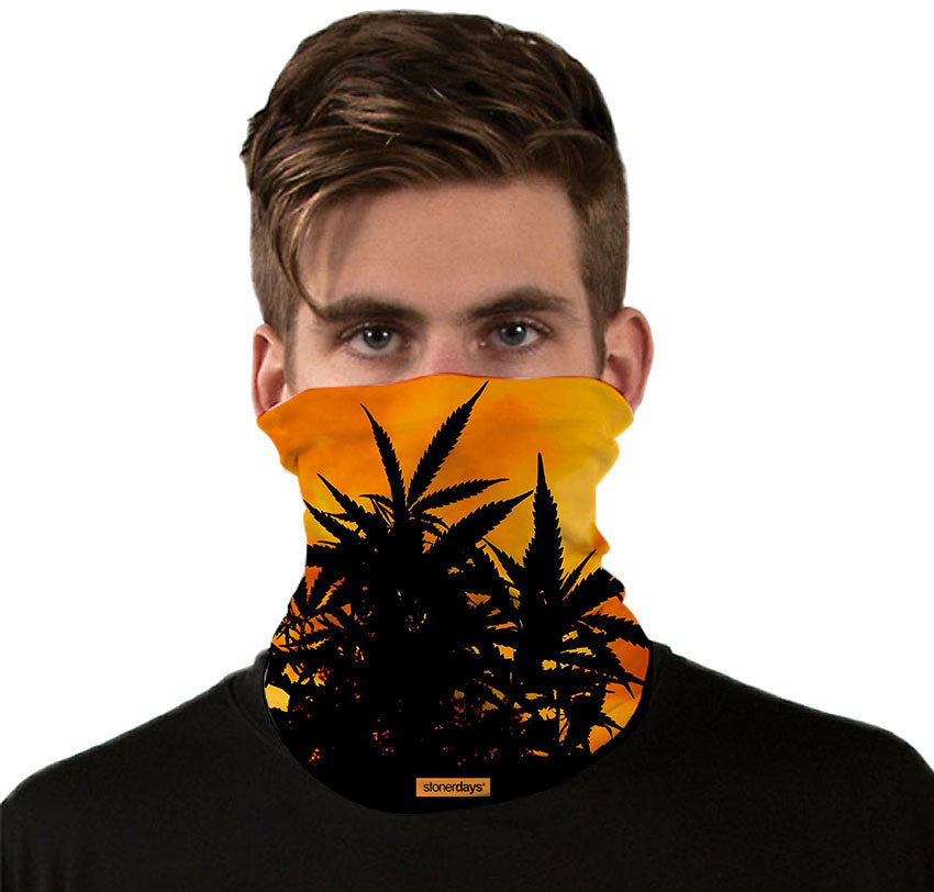 StonerDays Sunset Silhouette Neck Gaiter with cannabis design, front view on model