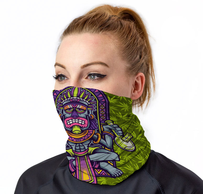 StonerDays Tiki Bongs Neck Gaiter with vibrant green and purple tiki design, worn by model