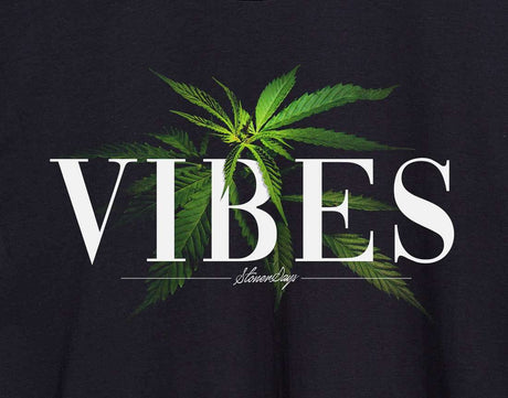 Close-up of StonerDays Vibes Hoodie with cannabis leaf design and logo on black cotton