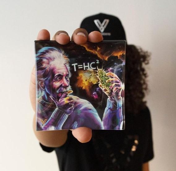 V Syndicate T=HC2 Black Hole Blazin' Glass Ashtray, compact and portable, with cosmic design, held in hand