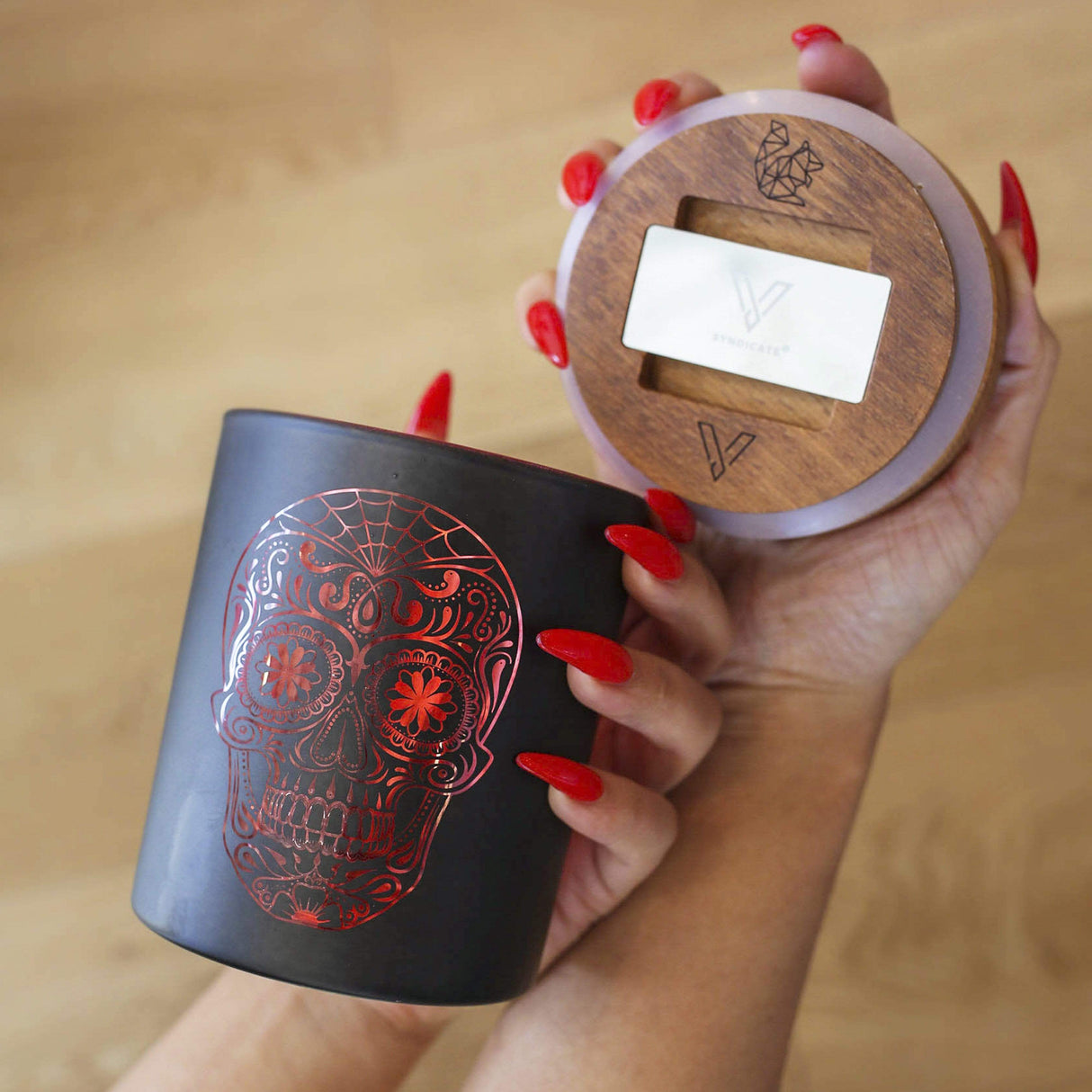 Hand holding Daze of the Dead Yellow SmartStash with wooden lid and built-in grinder