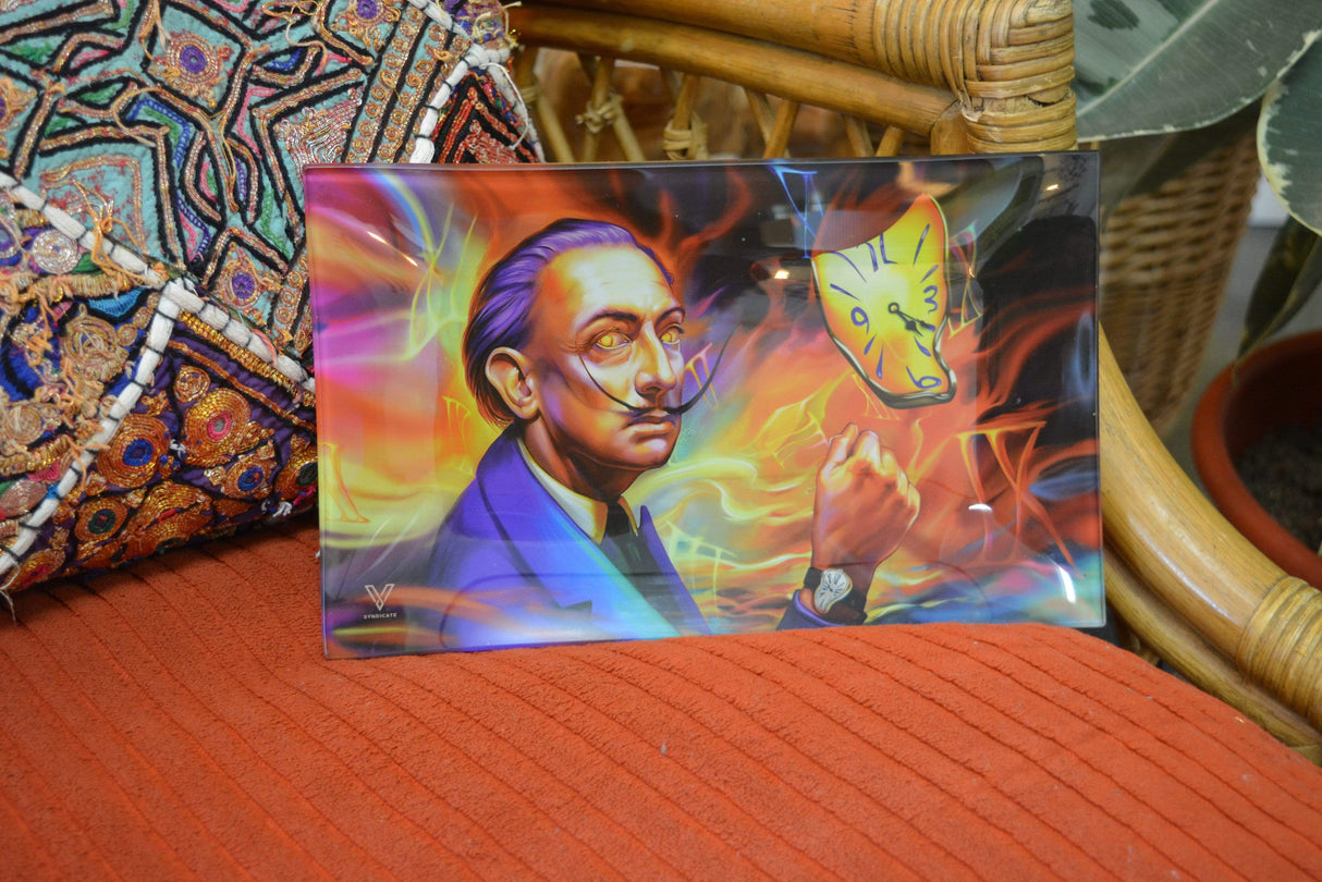 V Syndicate Dalirious Glass Rollin' Tray with vibrant Salvador Dali artwork, medium size, on an orange textile
