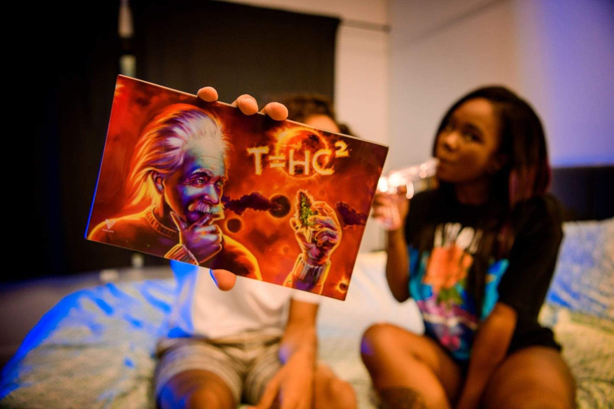 Person holding T=HC2 Solar Diesel Glass Rollin' Tray with Einstein design, medium size, perfect for home decor