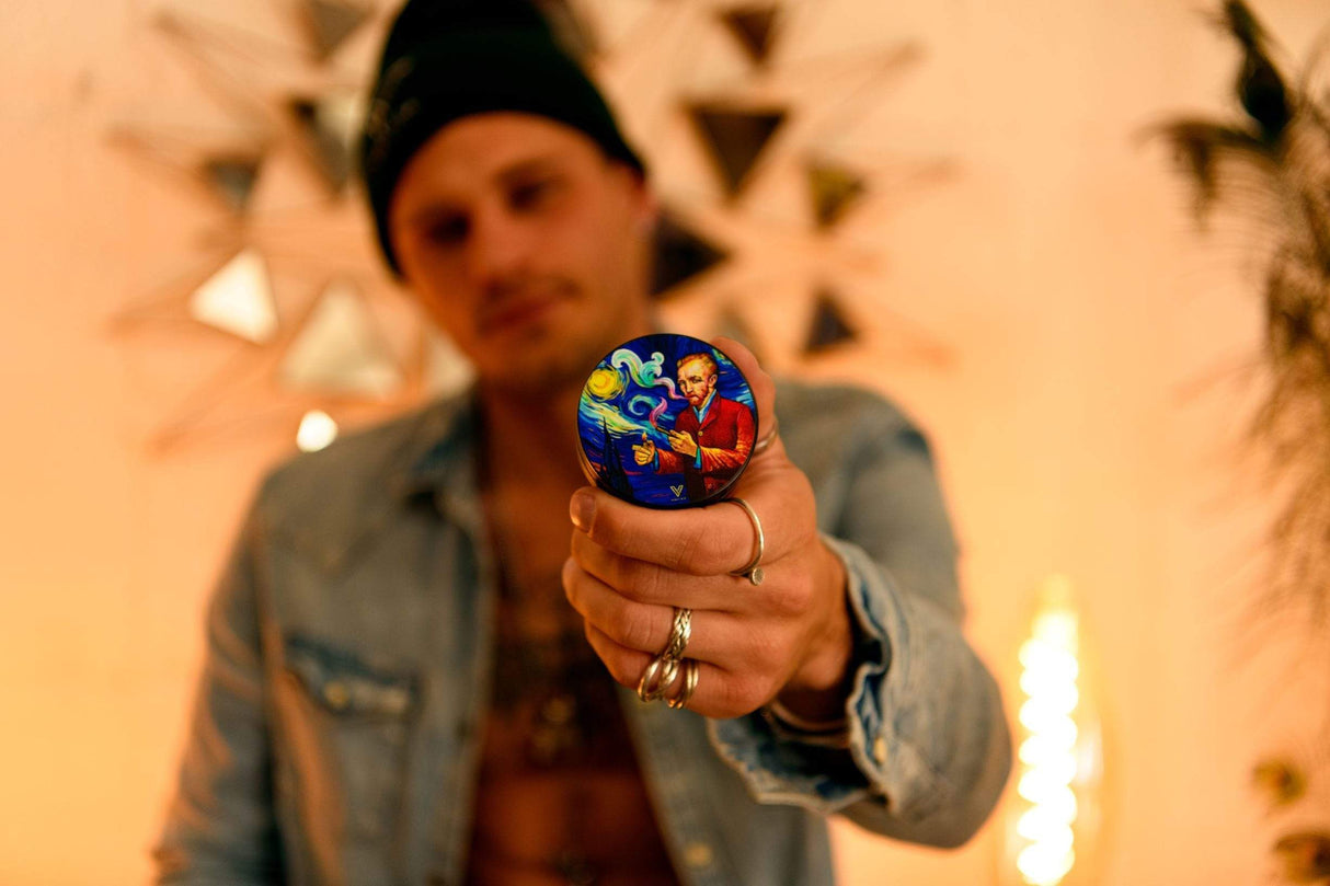 Person holding V Syndicate Smoky Night 2-Piece SharpShred Grinder, compact and portable design