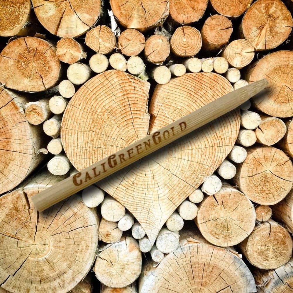 CaliGreenGold LaRosé Rose Petal Cone on Wood Logs Background