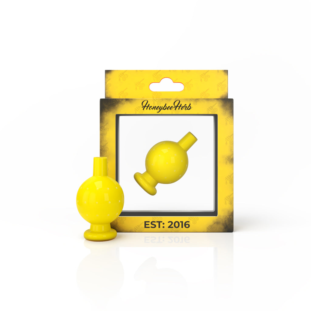Honeybee Herb Neon Yellow Bubble Carb Cap for Dab Rigs, front view on branded packaging