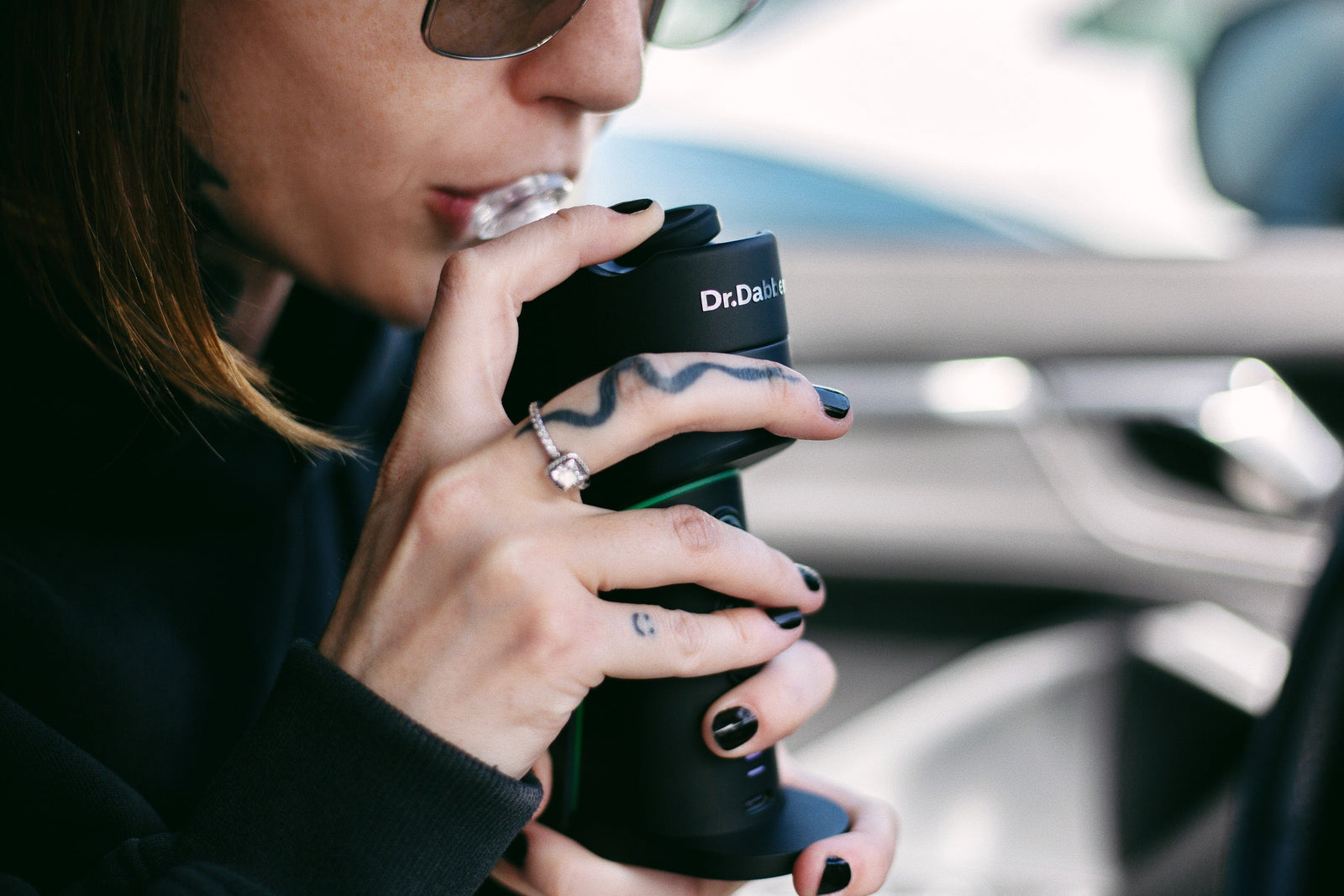 Woman using a Dr Dabber Switch GO Electric Dab Rig | DANKGEEK | Review for Better Daily Dabs