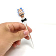 AFM Rick-themed Glass Dabber Tool with Character Top and Clear Shaft, Handheld View