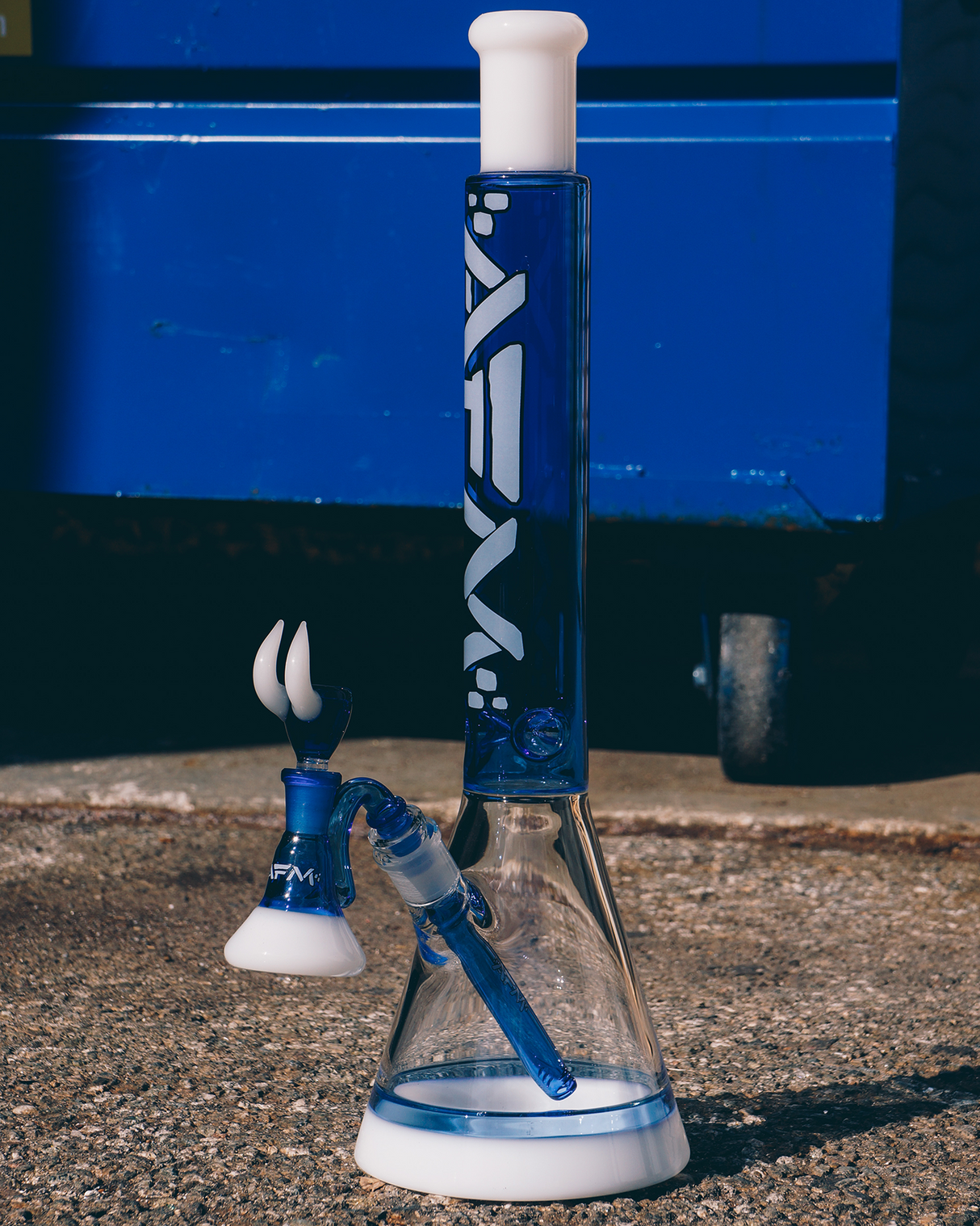 18" AFM Quasar Ink Blue Glass Beaker Bong with 14mm Female Joint on Concrete