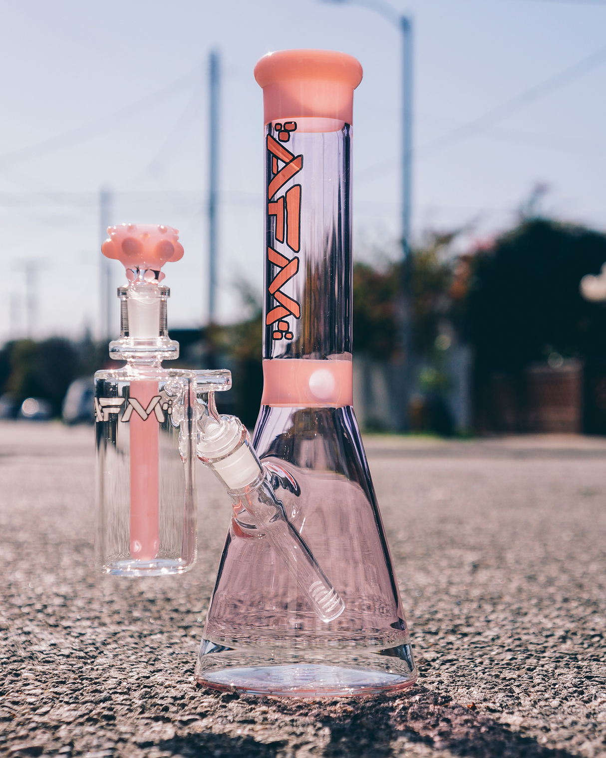 AFM Glass 12" Extraterrestrial Double Color Beaker Bong Bundle on pavement