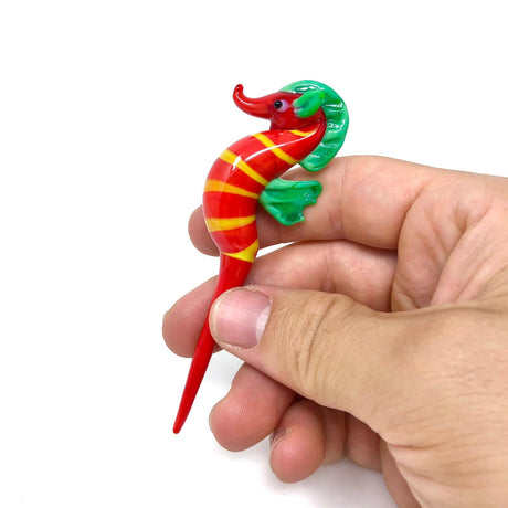 AFM - Seahorse Glass Dabber Tool in hand, vibrant red & yellow stripes, easy grip design