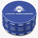 Kozo 3.5 inch ceramic non-stick aluminum grinder in blue, closed front view with the Kozo logo on the lid