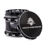 Kozo 2.5 inch window grinder in black, side viewing window with the lid tilted open to show the teeth