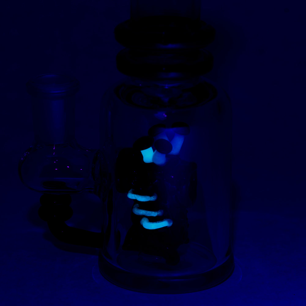 Empire Glassworks 'Renew the Redwood' Mini Tube glowing in dark, angled view