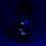 Empire Glassworks 'Renew the Redwood' Mini Tube glowing in dark, angled view