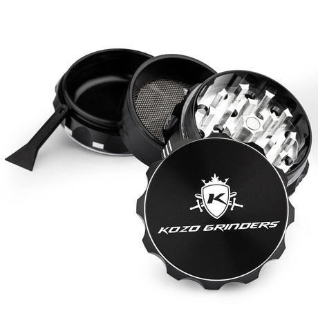 Kozo 2 inch four-piece aluminum grinder in black, split into four pieces with the pollen scraper