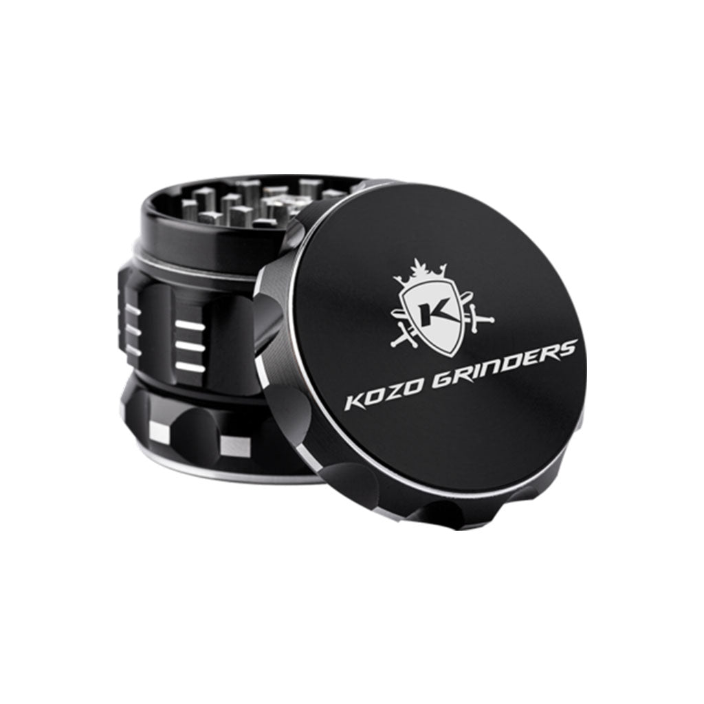 Kozo 2 inch four-piece aluminum grinder in black, lid tilted open beside the toothed grinding chamber