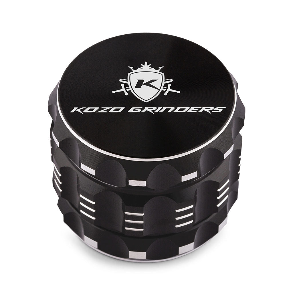 Kozo 2 inch four-piece aluminum grinder in black, closed front view of the body with the Kozo logo lid