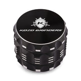 Kozo 2 inch four-piece aluminum grinder in black, closed front view of the body with the Kozo logo lid