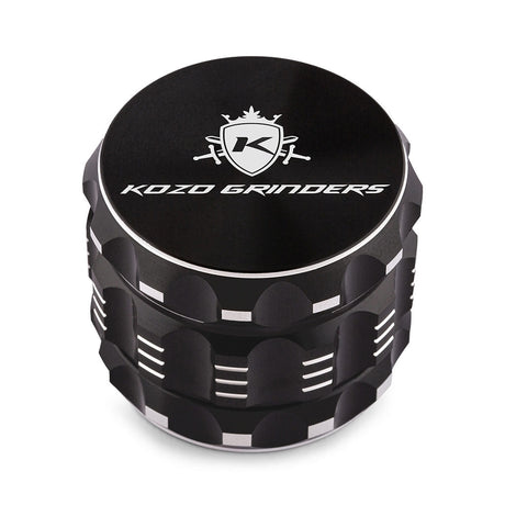 Kozo 2 inch four-piece aluminum grinder in black, closed front view of the body with the Kozo logo lid