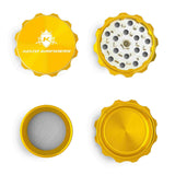 Kozo 2 inch four-piece aluminum grinder in gold, four pieces laid flat showing lid, teeth, screen and base