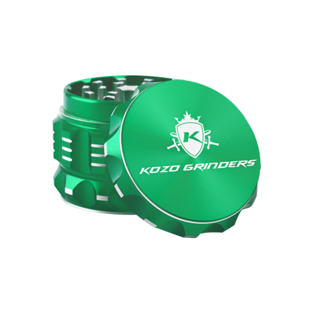 Kozo 2 inch four-piece aluminum grinder in green, lid tilted open beside the toothed grinding chamber