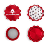 Kozo 2 inch four-piece aluminum grinder in red, four pieces laid flat showing lid, teeth, screen and base