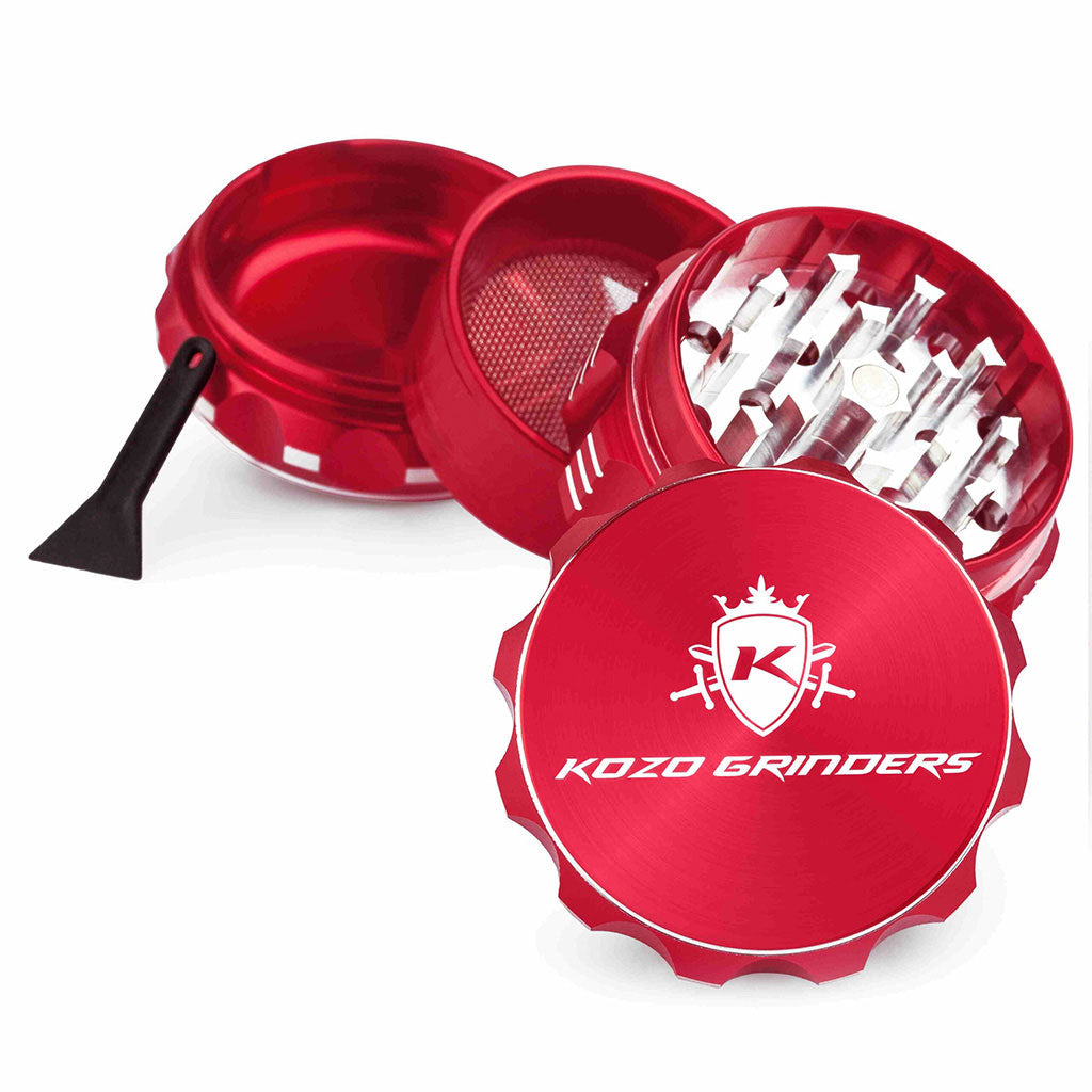 Kozo 2 inch four-piece aluminum grinder in red, split into four pieces with the pollen scraper