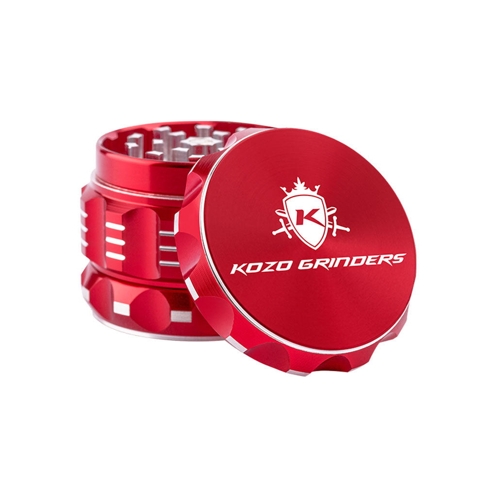Kozo 2 inch four-piece aluminum grinder in red, lid tilted open beside the toothed grinding chamber