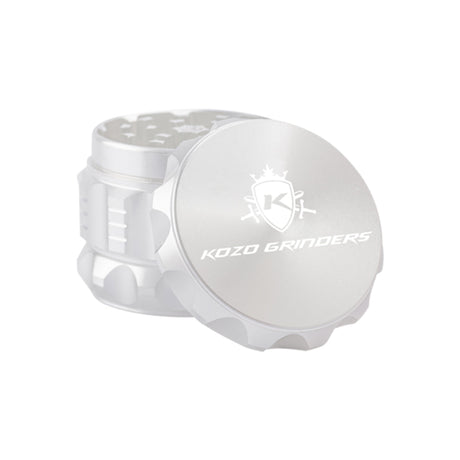 Kozo 2 inch four-piece aluminum grinder in silver, lid tilted open beside the toothed grinding chamber