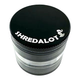 Sir Shredalot 4-Part Clear Chamber Grinder, top view showing the logo and textured grip