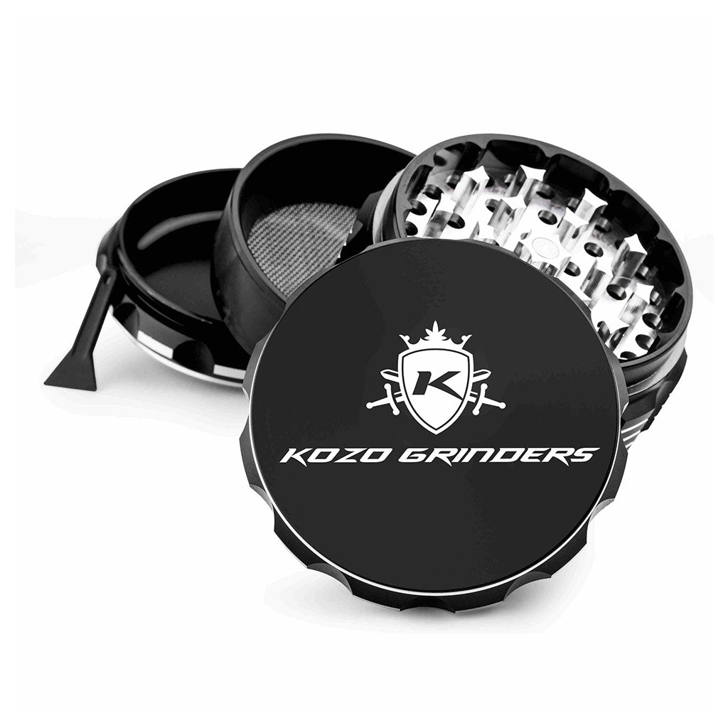 Kozo 3 inch four-piece anodized aluminum grinder in black, split into four pieces with the pollen scraper