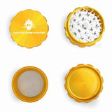 Kozo 3 inch four-piece anodized aluminum grinder in gold, four pieces laid flat showing lid, teeth, screen and base