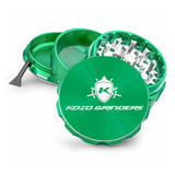 Kozo 3 inch four-piece anodized aluminum grinder in green, split into four pieces with the pollen scraper