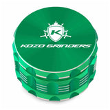 Kozo 3 inch four-piece anodized aluminum grinder in green, closed front view of the body with the Kozo logo lid
