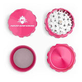 Kozo 3 inch four-piece anodized aluminum grinder in pink, four pieces laid flat showing lid, teeth, screen and base