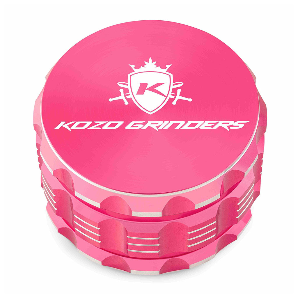 Kozo 3 inch four-piece anodized aluminum grinder in pink, closed front view of the body with the Kozo logo lid