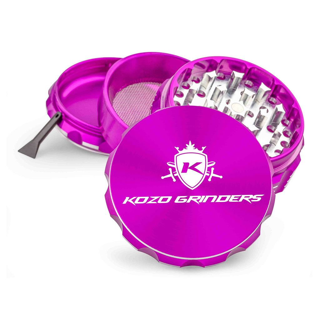 Kozo 3 inch four-piece anodized aluminum grinder in purple, split into four pieces with the pollen scraper