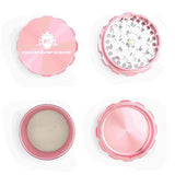 Kozo 3 inch four-piece anodized aluminum grinder in rose gold, four pieces laid flat showing lid, teeth, screen and base