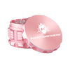 Kozo 3 inch four-piece anodized aluminum grinder in rose gold, lid tilted open beside the toothed grinding chamber